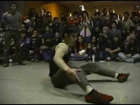 A Circus Runaways breaker holding a freeze in a cypher